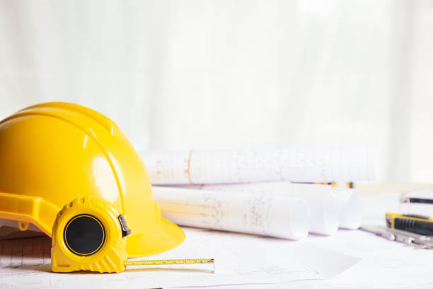 istock Work safety. Standard Construction site protective equipment on table wooden background, flat lay, copy space,safety first concepts. 1340871078