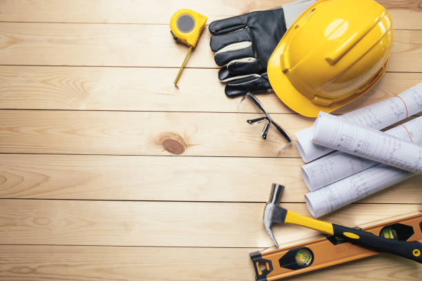 istock Work safety. Standard Construction site protective equipment on  top view wooden background, flat lay, copy space,safety first concepts. 1340871086