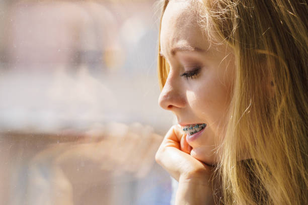istock Girl on window enjoying sunny day 1340871143