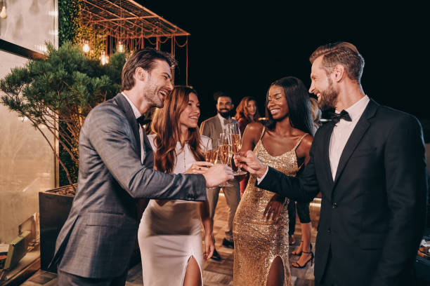 istock Group of people in formalwear communicating and smiling 1340871453