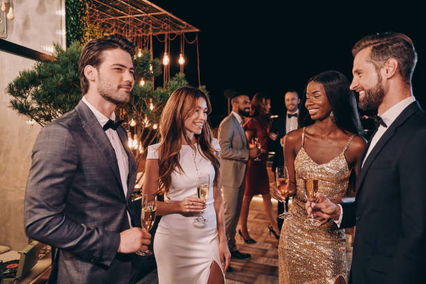 istock Group of people in formalwear communicating and smiling 1340871969