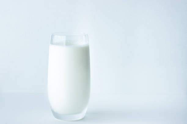 Glass of milk on white background with copy space; cows milk; calcium source