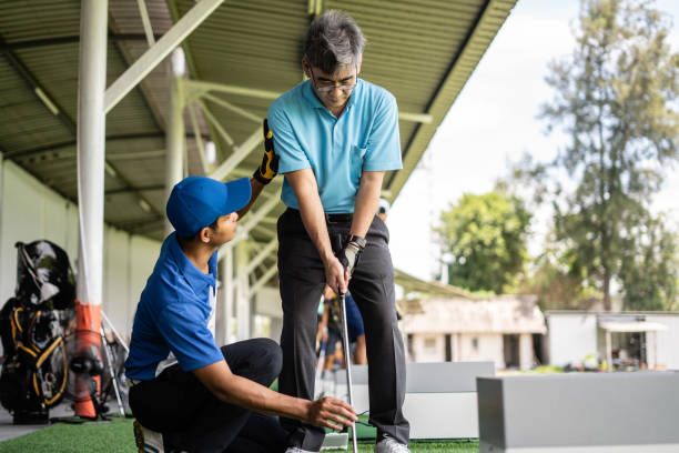 istock Man Teaching Senior Man To Play Golf 1340874846