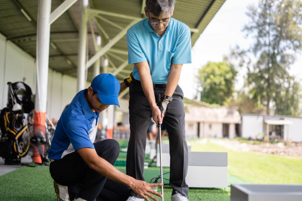 istock Man Teaching Senior Man To Play Golf 1340875790