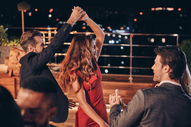 istock Beautiful young people dancing and smiling 1340876268