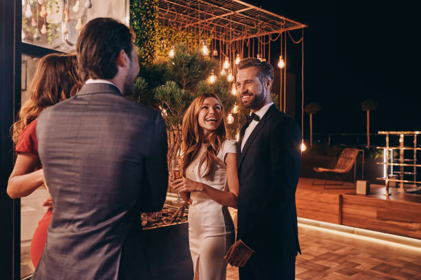 istock Group of people in formalwear communicating and smiling 1340877365