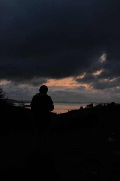istock A single silhouette on a hill above sea coast for outdoor advertisement 1340877373