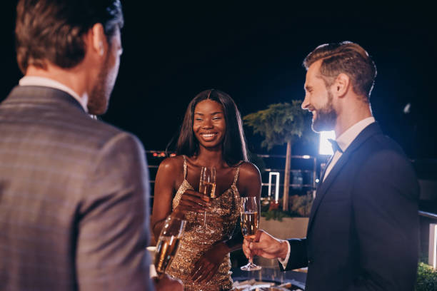 istock Group of people in formalwear communicating and smiling 1340877376