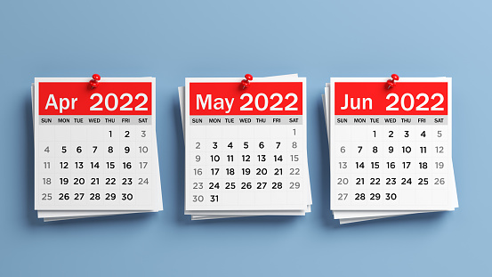 Red and white-colored 2022 April, May, June calendar pages. On blue-colored background. Horizontal composition with copy space. Isolated with clipping path.