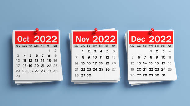 rote und weiße kalenderseiten 2022 oktober, november, dezember. - dezember stock-fotos und bilder