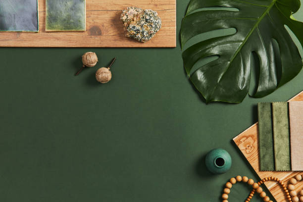 istock Stylish flat lay composition of creative architect moodboard design with samples of building, textile and natural materials and personal accessories. Top view, green background, template. 1340877669