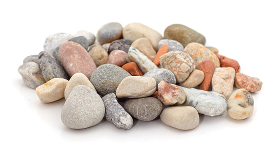 White pebbles stone by river or sea. White stone texture and background.
