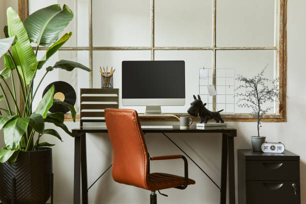 istock Creative composition of modern masculine home office workspace interior with black industrial desk, brown leather armchair, pc and stylish personal accessories. Template. 1340881650