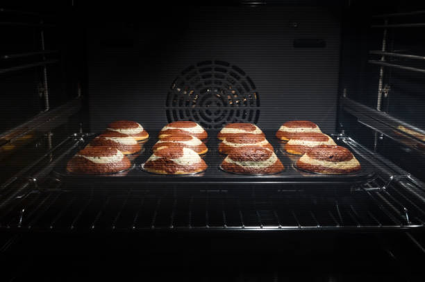 istock Chocolate muffins in oven 1340881713