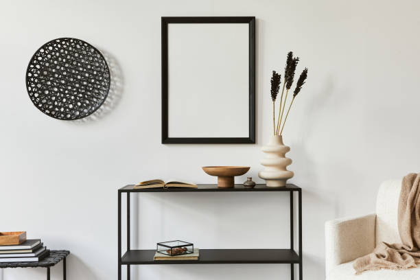 istock Minimalistic stylish composition of creative room interior design with mock up poster frame, metal shelf, armchair and personal accessories. Black and white concept. Template. 1340882098