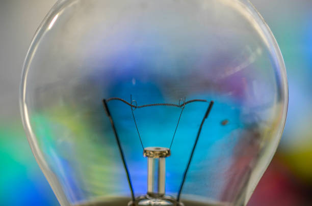 istock Light bulb with a colorful background 1340882117