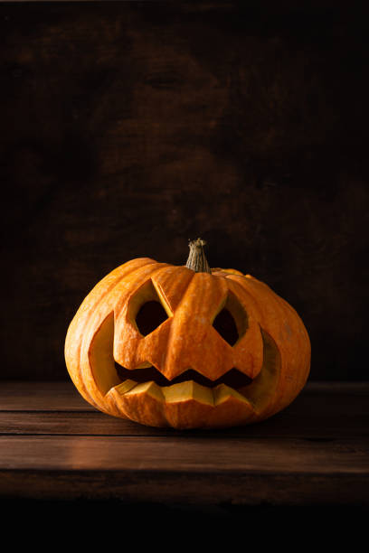 istock Big Halloween pumpkin on a wooden table 1340883467