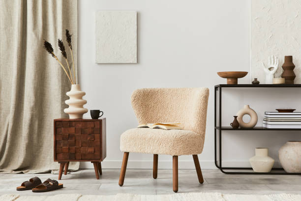 istock Creative composition of cozy living room interior design with mock up structure painting, fluffy armchair, commode and personal accessories. Modern classic style. Template. 1340884409