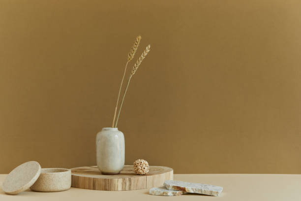 istock Stylish minimalistic interior design with copy space, natural materials as wood and marble, dry plants and personal accessories. Neutral and yellow colours, template. 1340884622