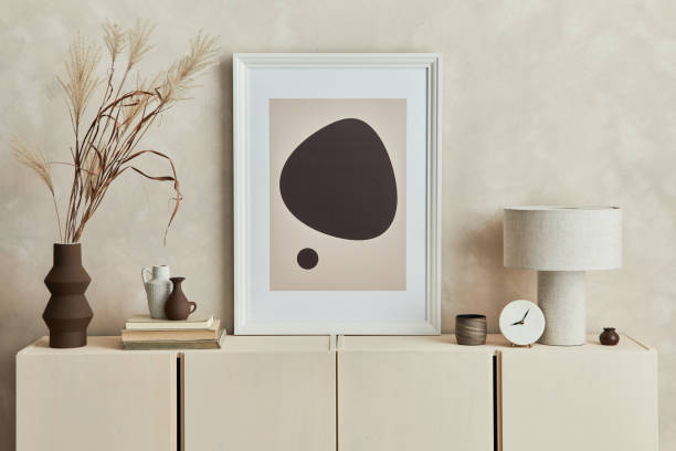 istock Stylish composition of cozy living room interior design with mock up poster frame, commode and personal accessories. Modern style. Template. 1340884731