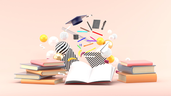 School Supplies Floating out of a book amidst colorful balls on a soft pink background.-3d render.