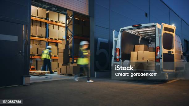 Outside Of Logistics Distributions Warehouse Diverse Team Of Workers Loading Delivery Truck With Cardboard Boxes Online Orders Purchases Ecommerce Goods Supply Chain Blur Motion Shot Stock Photo - Download Image Now