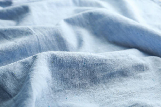 istock Texture of light blue fabric as background, closeup 1340890312