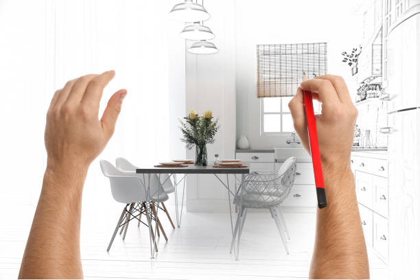 istock Man drawing kitchen interior design. Combination of photo and sketch 1340890460