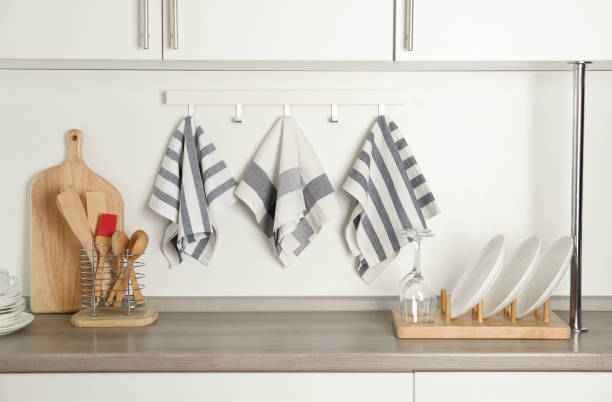 istock Different kitchen towels hanging on hook rack indoors 1340890619