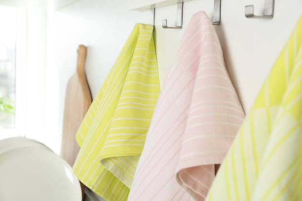 istock Different kitchen towels hanging on hook rack indoors, closeup 1340890715
