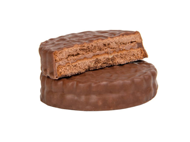 istock Brown chocolate sandwich cookies isolated on the white background 1340891025