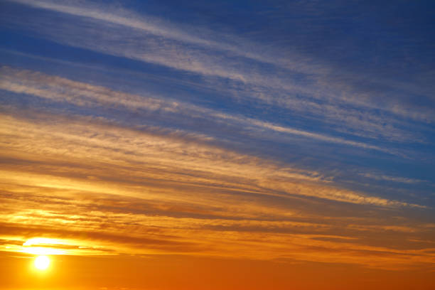istock Sunset clouds sky in orange and blue 1340894777