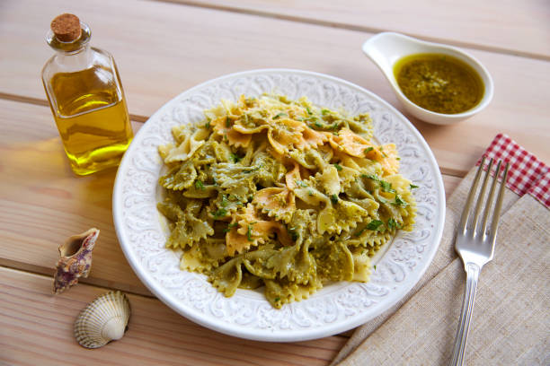istock Farfalle pasta with Pesto on wood 1340896552