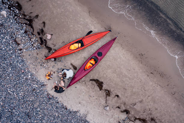 istock Couple Relaxing After Kayak Trip 1340896909
