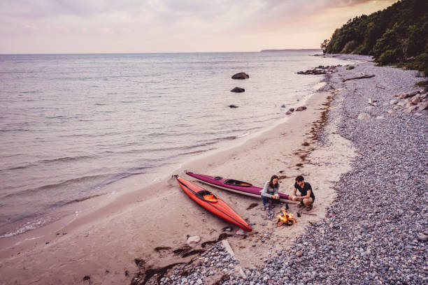 istock Couple Relaxing After Kayak Trip 1340897065