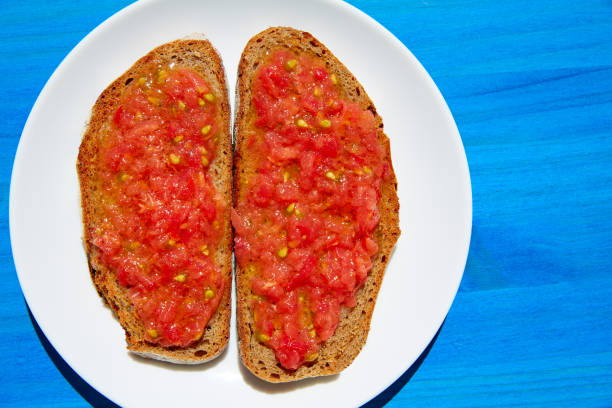 istock Bread toasted slices with grated tomato 1340898389