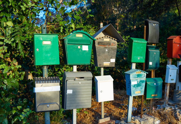 istock Grunge mailboxes on poles in a forest 1340898612