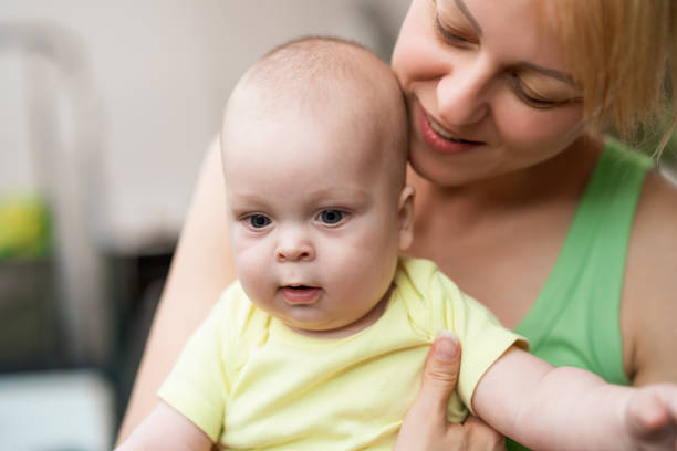 istock Mother with her cheerful  baby boy 1340900563