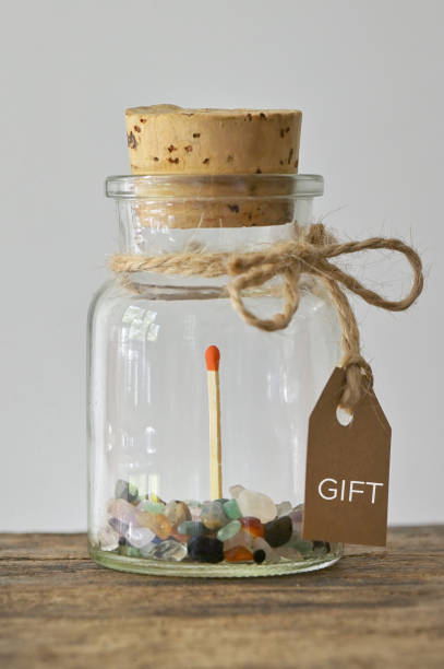 istock Abstact Gift. Jar with Match Stick and Precious Stones 1340904554