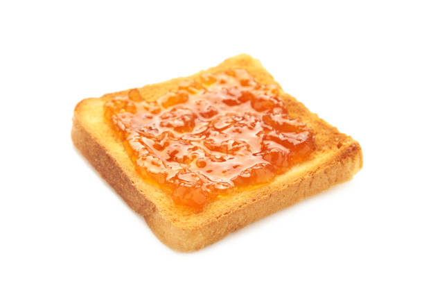 Toast with jam isolated on white background. Top view