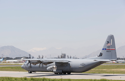 Kabul, Afghanistan - April 22, 2016: U.S. Airforce C-130 Hercules Military cargo aircraft is on taxi way before take off in Kabul International Airport.
