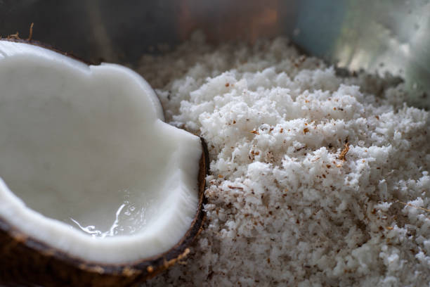 istock Fresh coconut flakes on a black background 1340913283