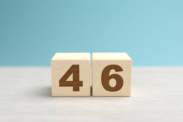 istock Wooden toy blocks forming the number 46. 1340914594