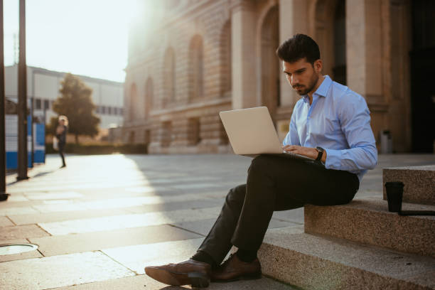 istock Successful entrepreneur working on laptop outdoors 1340920092