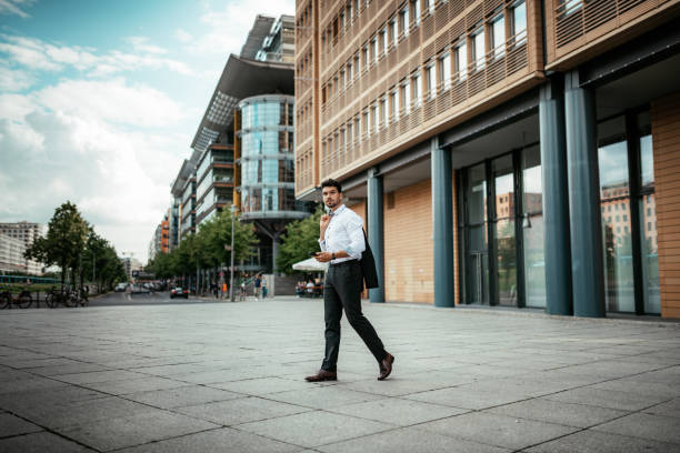 istock Millennial businessman using phone for business plannings 1340920111