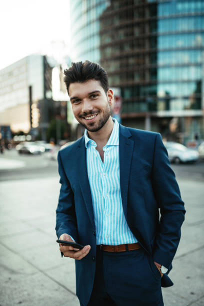 istock Millennial businessman using phone for business plannings 1340920177