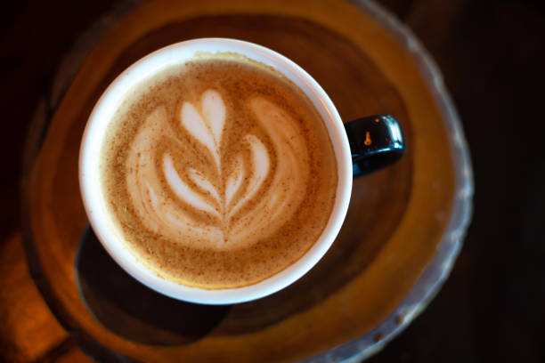 istock Hot cappuccino coffee in cup on table as beverage background 1340921482