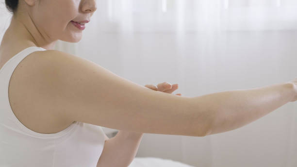 istock positive asian female hands applying hand cream. 1340923772
