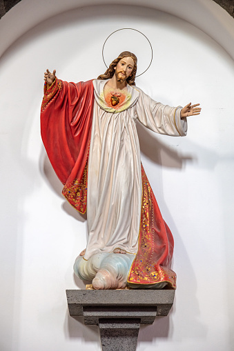 Figure of Jesus Christ with the holy heart in Igreja De Nossa Senhora da Alegria church in the town Furnas on the Portuguese Azorean Island San Miguel in the center of the North Atlantic Ocean. It is a modern church, build in 1960.