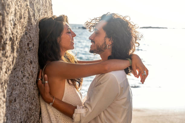 istock Romantic beautiful couple on a date on the beach. 1340925911